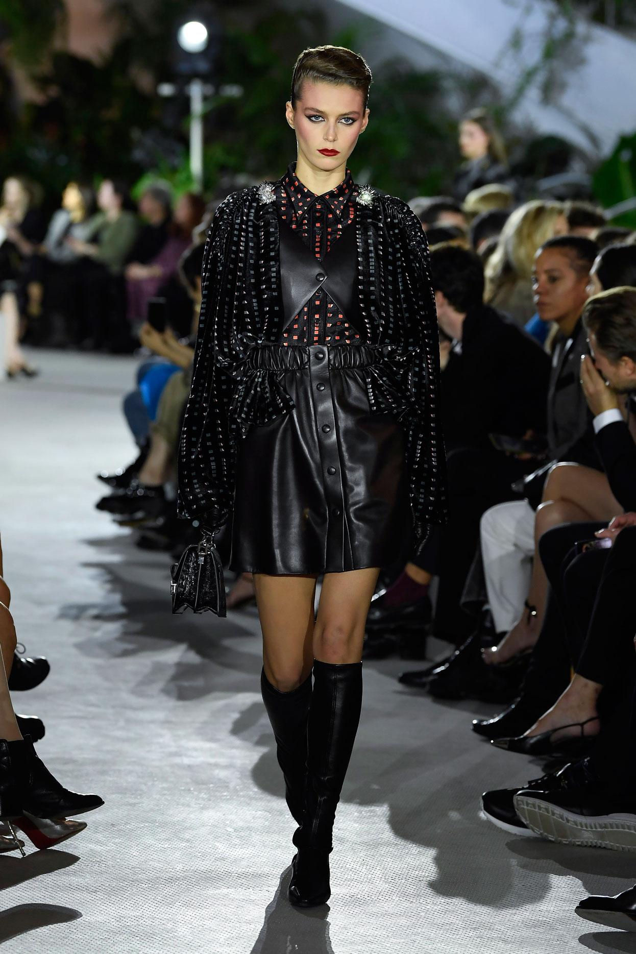 A model walks the runway during the Louis Vuitton Cruise 2020